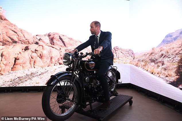 The future King posing on a model motorbike during a visit to Ulster University's Belfast City Campus in November