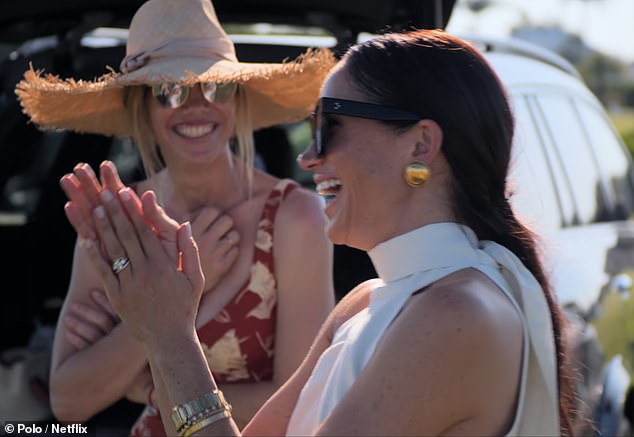 Supportive duchess: Meghan applauded enthusiastically from the sidelines as she watched Harry score a goal