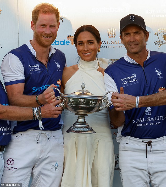 Pictured: The Duke and Duchess of Sussex pose with Adolfo Cambiaso following Royal Salute's victory at the Royal Salute Polo Challenge in April