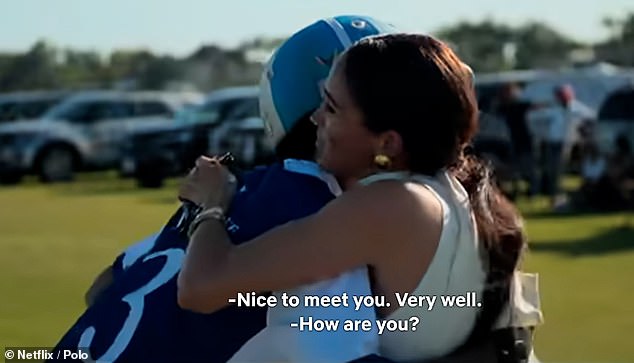 As the Duchess approached Adolfo on the field, the player reached out his palm for a handshake - before Meghan went in for a hug