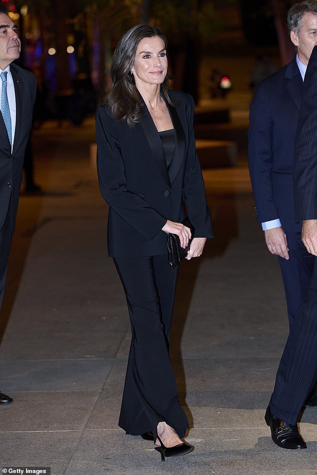 Queen Letizia of Spain's chic co-ord proves that sequins and velvet aren't the only way to dress as the Christmas party season draws closer. Choosing a tuxedo at the 41st Francisco Cerecedo Journalism Awards, she championed the High Street in her blazer and trousers from Mango