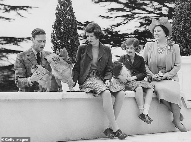 Queen Elizabeth, Princess Margaret, Princess Elizabeth and King George VI with the family dogs Ching, Carol and Crackers at the Royal Lodge in Windsor in April 1940