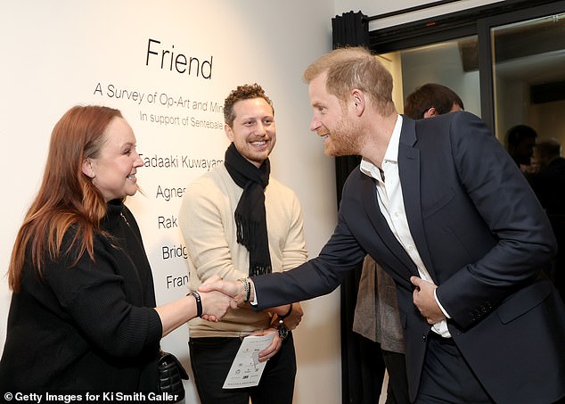 Prince Harry with guests Dana Craig and Alex Goldstein at the Ki Smith Gallery yesterday