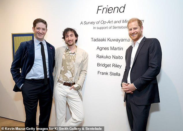 Art lawyer Hanoch Sheps (left), Ki Smith (centre) and Harry (right) at the gallery last night