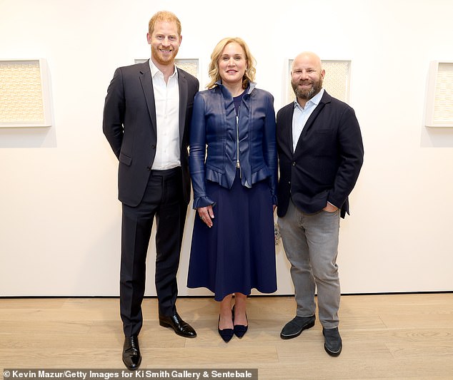 Prince Harry with guests Leslie Arker (centre) and Alex Arker (right) in New York last night