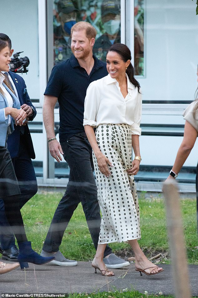 During her summer trip to Colombia, Meghan embraced laidback elegance in a white silk shirt by Giuliva Heritage, aptly named the 'Husband'