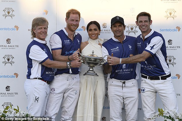 Harry and Meghan pose alongside Dana Barnes, left, Adolfo Cambiaso and Malcolm Borwick during a polo event in April