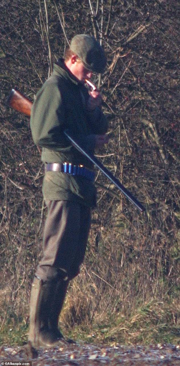 Prince Harry sneaks away from a Royal shoot at Sandringham to light up a cigarette