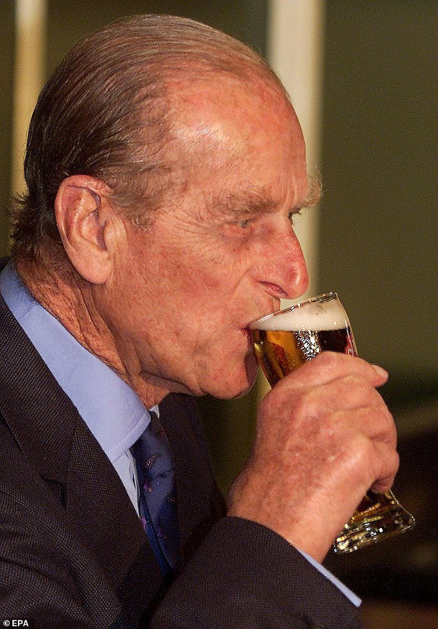 Prince Philip drinking a glass of beer in Launceston, Tasmania, while on a tour of a local beer manufacturers in 2000