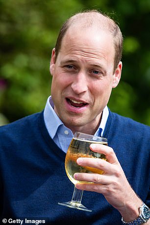 The Prince of Wales holding a glass of cider