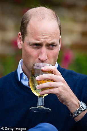 Prince William taking a sip of cider