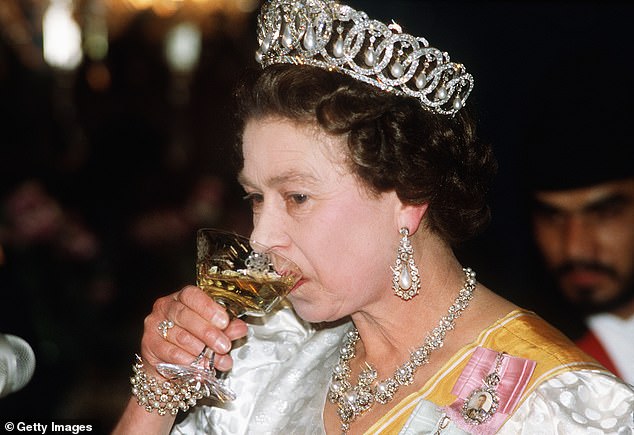 The late Queen Elizabeth sipping a glass of champagne in Nepal back in 1986