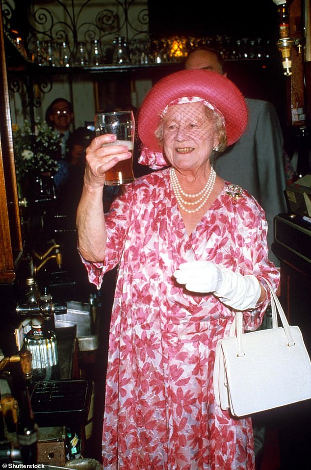 The Queen Mother with a pint of beer at the Queen's Head pub in London in 1987