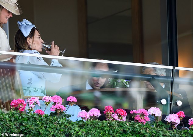 Carole Middleton, Kate's mother, enjoying a glass of wine at Royal Ascot in June