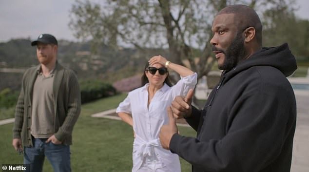 Pictured: the Duke and Duchess of Sussex with Tyler Perry in the garden of his Los Angeles home in their Netflix docu-series