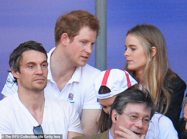 Harry and Cressida look on during a Six Nations match between England and Wales at Twickenham Stadium on March 9, 2014