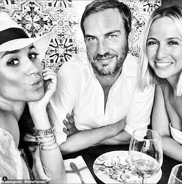 Meghan and Misha met through their mutual friend Markus Anderson, centre, in 2014