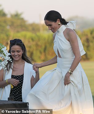 Meghan wore this simple and similar off- white dress in 2024