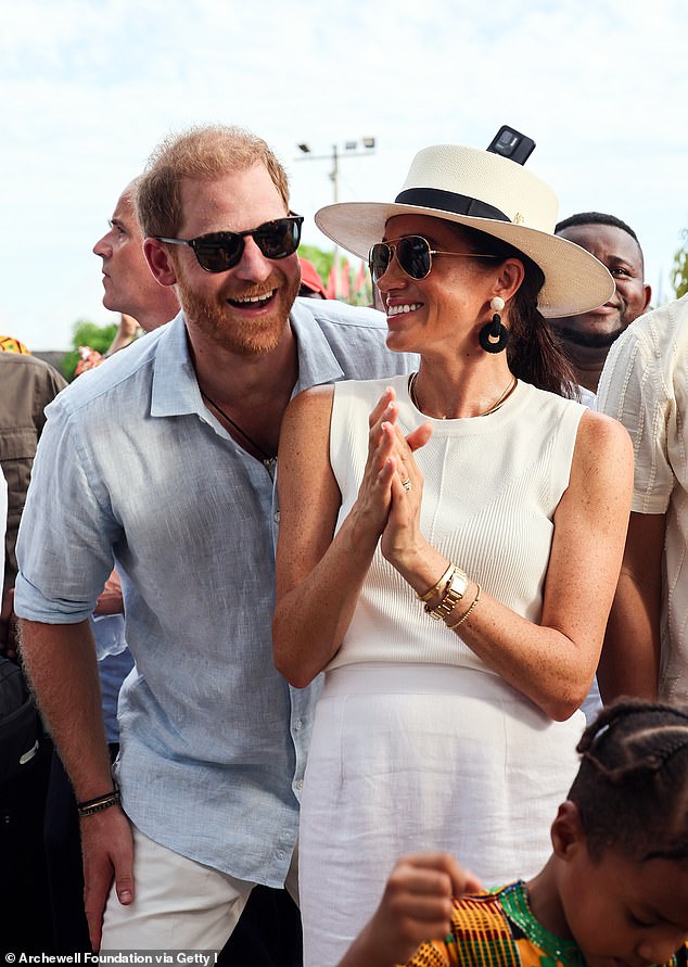 Prince Harry and Meghan are pictured at San Basilio de Palenque in Colombia