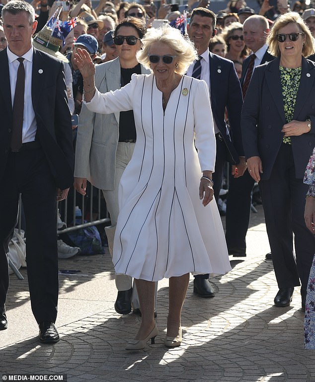 Camilla waving to Australian fans during her visit to the Sydney Opera House with Charles