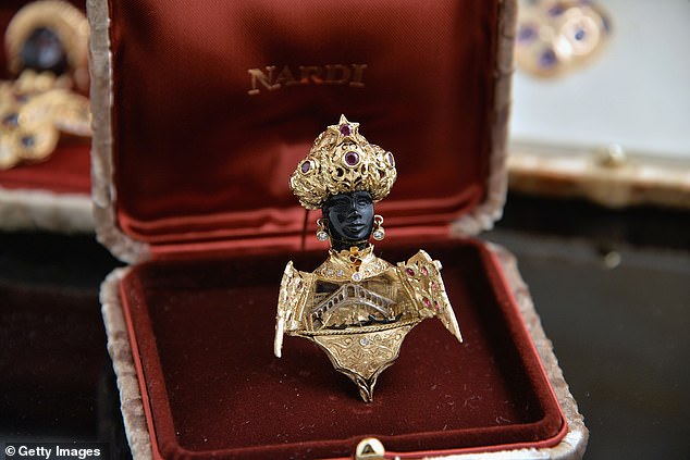 Princess Michael, who is married to the Queen's cousin, Prince Michael, could clearly be seen wearing the jewellery on her coat as she drove through the gates (pictured, a similar brooch)