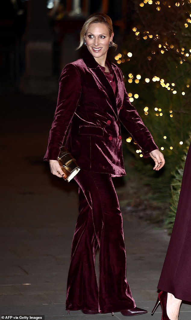 Zara clearly enjoyed the royal fashion memo, donning a velour trouser-suit the colour of burgundy, alongside matching heels and a gold bag for the event