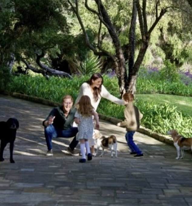 The Duke and Duchess' Christmas card included a image of Archie, five, and Lilibet, three, running into their parents arms with their backs facing the camera, which led royal fans to spread baseless claims that the Duke and Duchess had 'faked' the photo with Photoshop