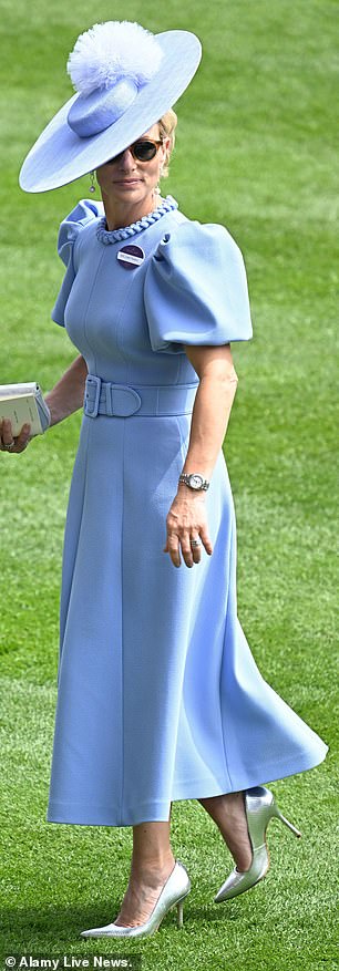 At Royal Ascot, Zara showcased a powder blue dress fit-and-flare dress by Rebecca Vallance, complemented by bespoke headwear from Sarah Cant