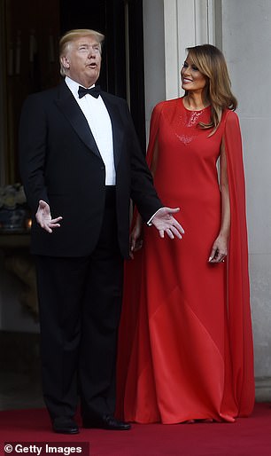 Melania Trump in 2019 wearing a caped Givenchy gown during  their UK tour