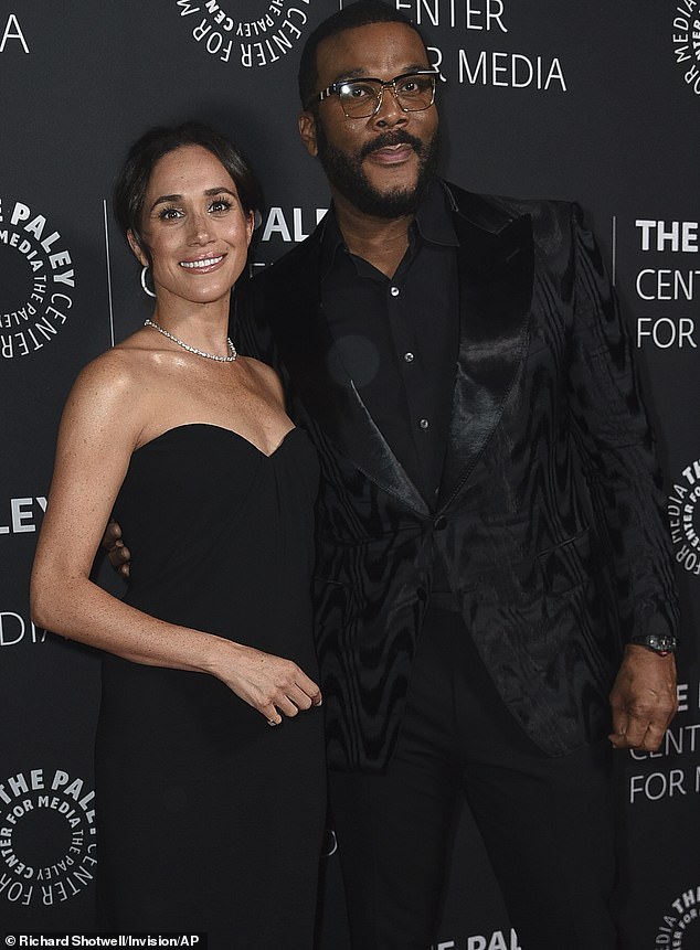 Tyler Perry is photographed with his friend Meghan Markle at the Paley Honors Fall Gala on December 4 at the Beverly Wilshire Hotel in Beverly Hills