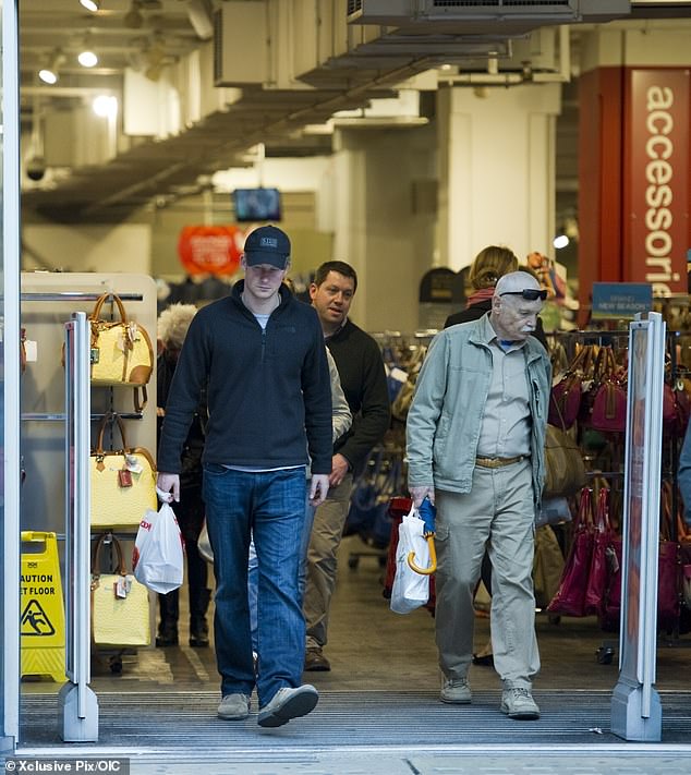 Prince Harry leaving T. K. Maxx in Kensington  High Street with a shopping bag back in 2013