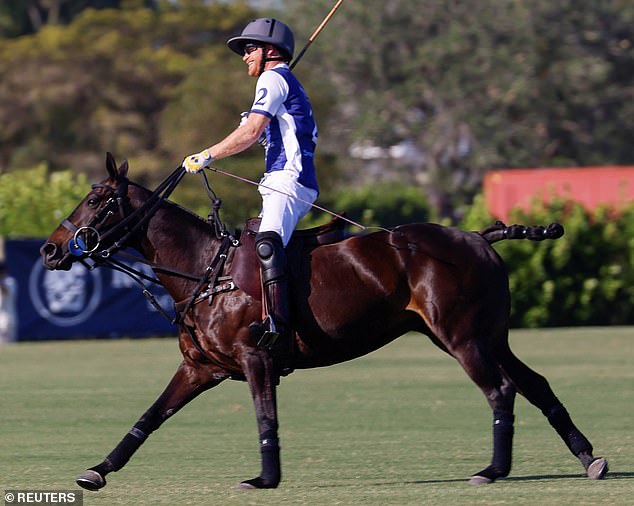 Harry looked thrilled to be back in the saddle and was seen grinning from ear-to-ear as he warmed up for the match