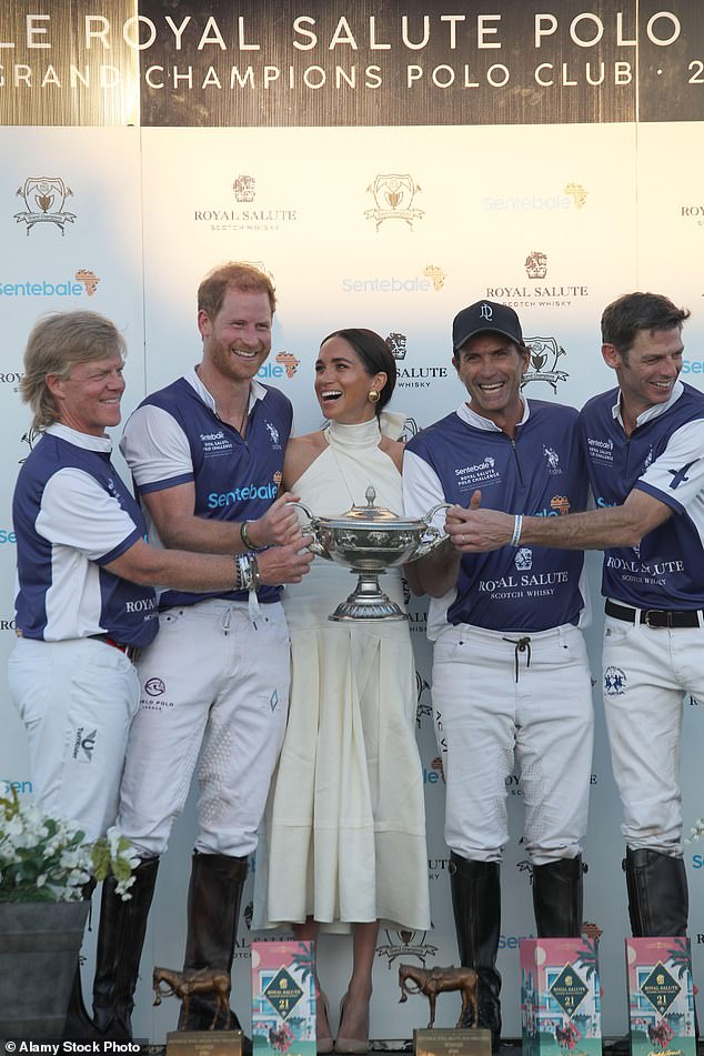 Body language expert Judi James noted the Duchess of Sussex exhibited something akin to 'maternal' pride while presenting the winner's trophy to Prince Harry after a charity polo match, documented in the couple's new Netflix series