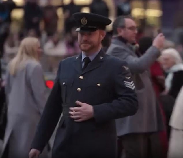 A chipper-looking Prince of Sussex lookalike is seen strolling in military uniform outside of Westminster Abbey ahead of the Princess of Wales' Together At Christmas concert