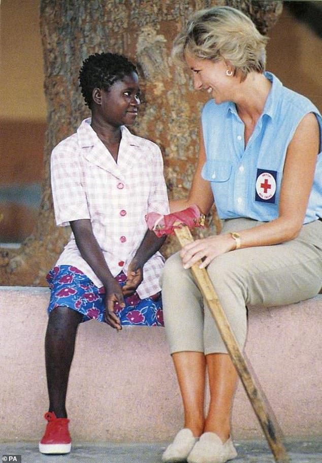 The princess speaking with minefield victim Sandra Thijika, 16, in 1997