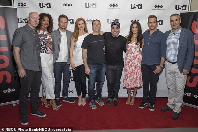 The cast of Suits in 2016 (L2R): Gene Klein, Gina Torres, Patrick J. Adams, Sarah Rafferty, Aaron Korsh, Rick Hoffman, Meghan Markle, Gabriel Macht, David Bartis