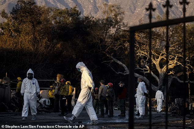 A search team looks for victims' remains at a home destroyed by the Eaton Fire in Altadena, California, on January 11