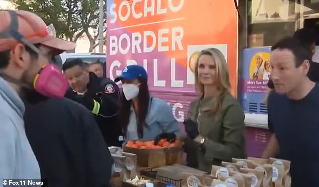 Meghan and Harry stood alongside the embattled California governor's wife as they served meals to the survivors of the Los Angeles wildfires