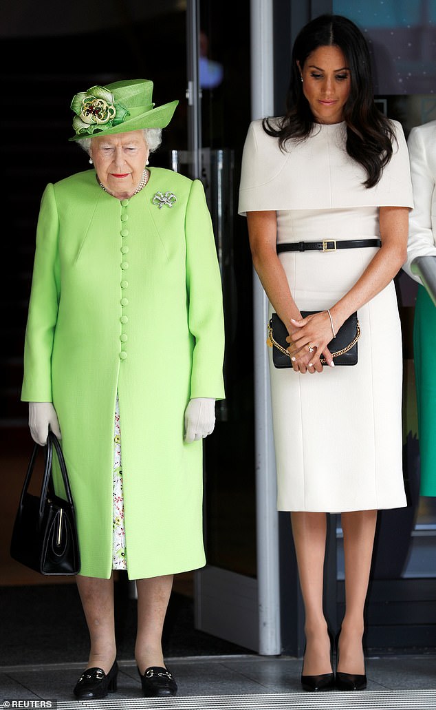 Queen Elizabeth II and Meghan observe a moment of silence in memory of the victims of the Grenfell Tower fire