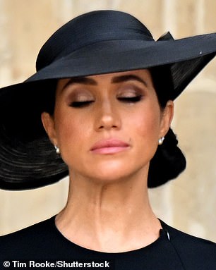 Meghan would later wear these same earrings to the monarch's funeral in September 2022