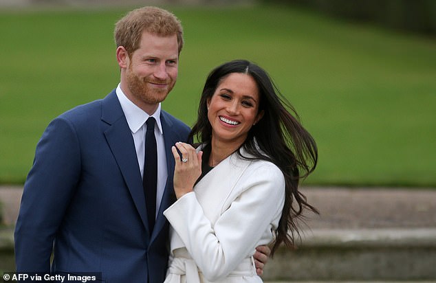 The smitten Prince Harry, standing with his then fiance, designed Meghan's engagement ring himself back in 2017