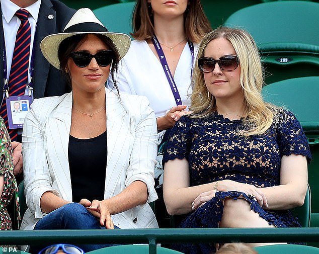 The Duchess of Sussex (centre), 43, and Lindsay (right) have been close for many years and attended Wimbledon together in 2019