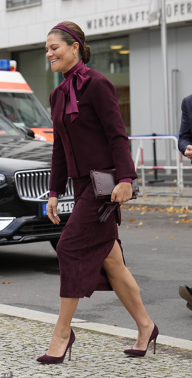 In October, Princess Victoria of Sweden showcased a charming berry-hued ensemble during an official trip to Berlin