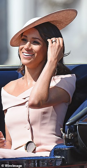 Meghan debuted a custom straw version at Trooping the Colour in 2018, paired with a pale pink Carolina Herrera off-the-shoulder dress