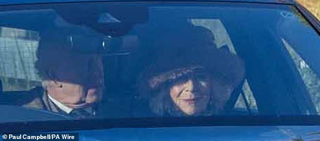 Wearing a smart cream coat, the King sat behind the Queen as they were driven through the streets of Crathie on the chilly winter day