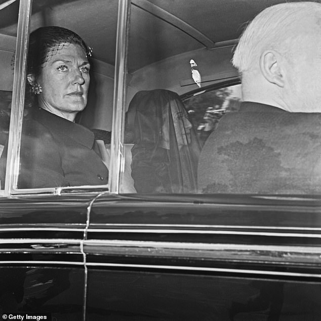 Wallis (with veil) is driven to the funeral of her husband, the Duke of Windsor, in 1972