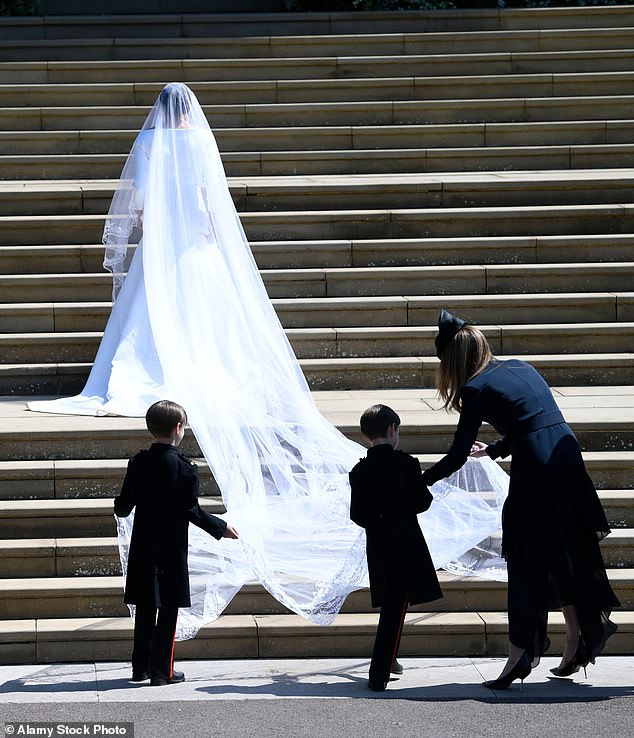 Meghan Markle arrives at St George's Chapel in Windsor Castle for her royal wedding ceremony on May 19, 2018