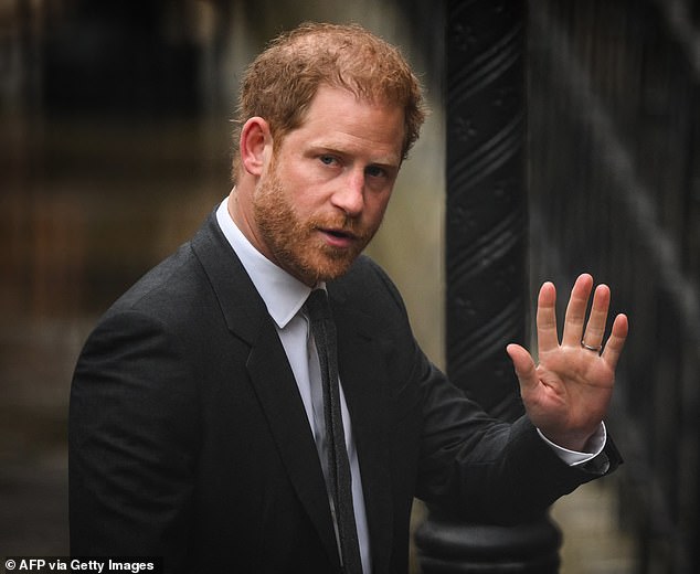 Prince Harry, Duke of Sussex waves as he arrives at the Royal Courts of Justice, Britain's High Court, in central London on March 28, 2023