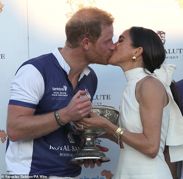 Meghan and Harry kiss at a polo event to raise money for his charity Sentebale