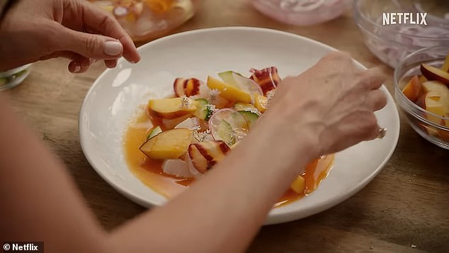 Meghan prepared a light, summery dish that appears to incorporate peaches, thinly sliced radishes and cucumber with a dressing